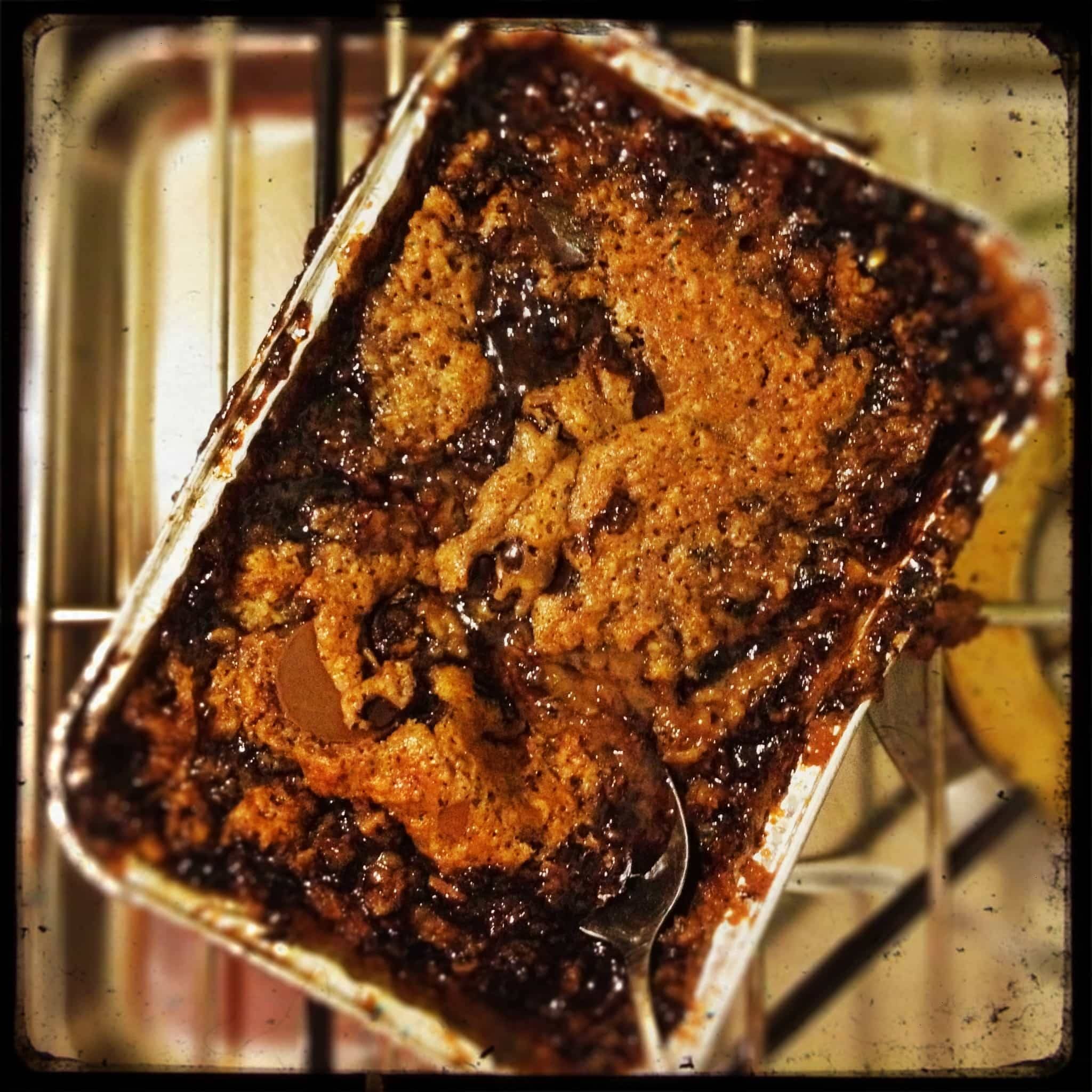 Burnt food in a aluminum dish.