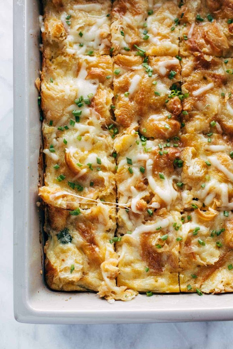 Egg and croissant bake in a pan.