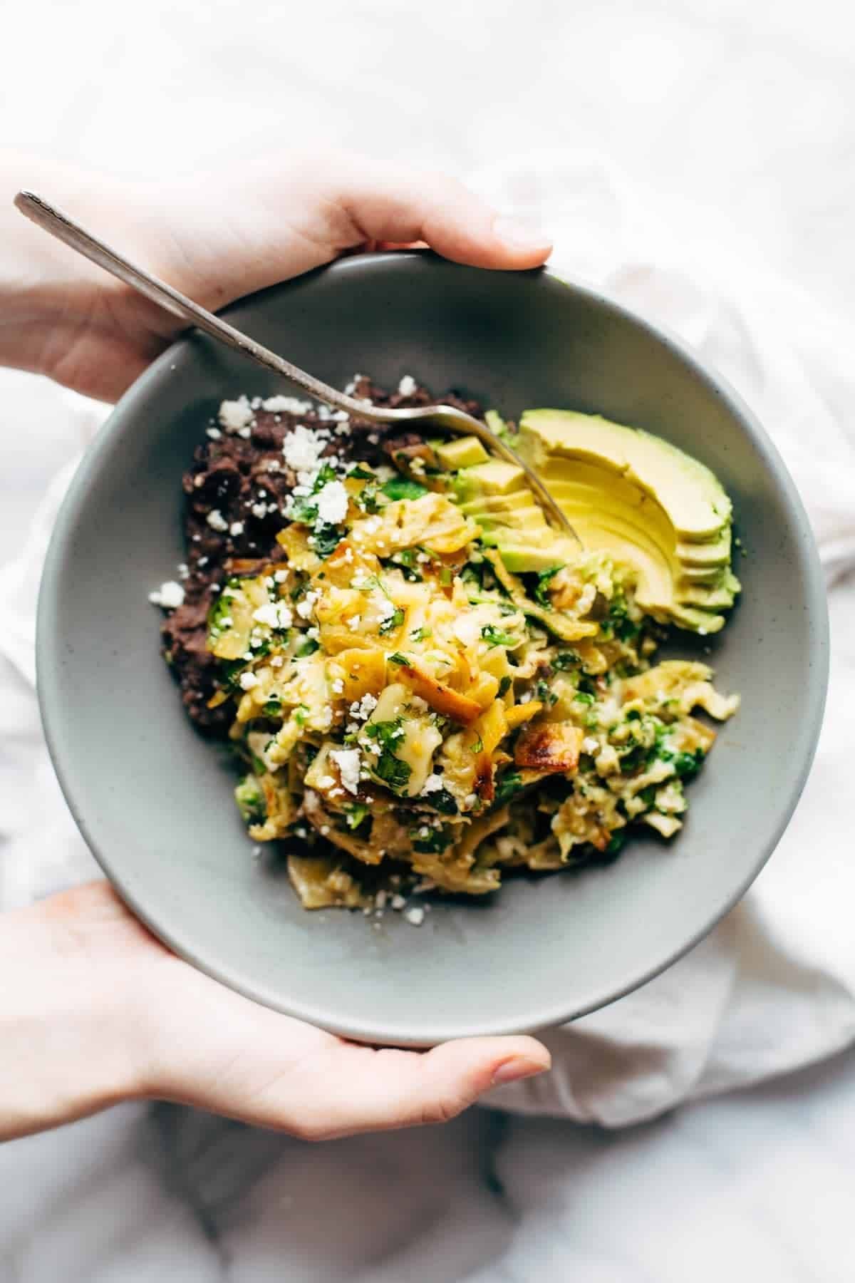 The best migas in a bowl with avocado.