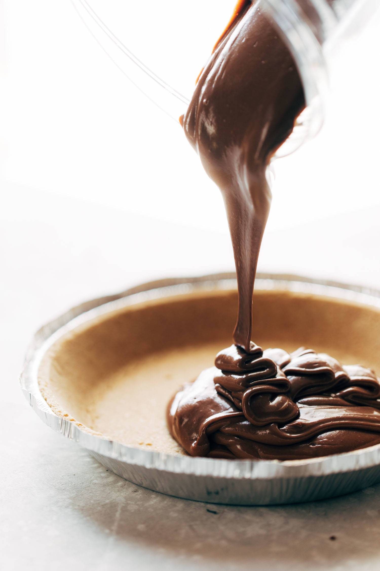 This no-bake vegan chocolate pie only requires five ingredients! Kinda like a French Silk Pie, but better for you. Vegan / Dairy Free / Gluten Free | pinchofyum.com
